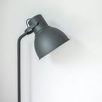 Vela floor lamp with a slim adjustable profile