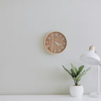 Natural Pacer wall clock styled in a bright workspace