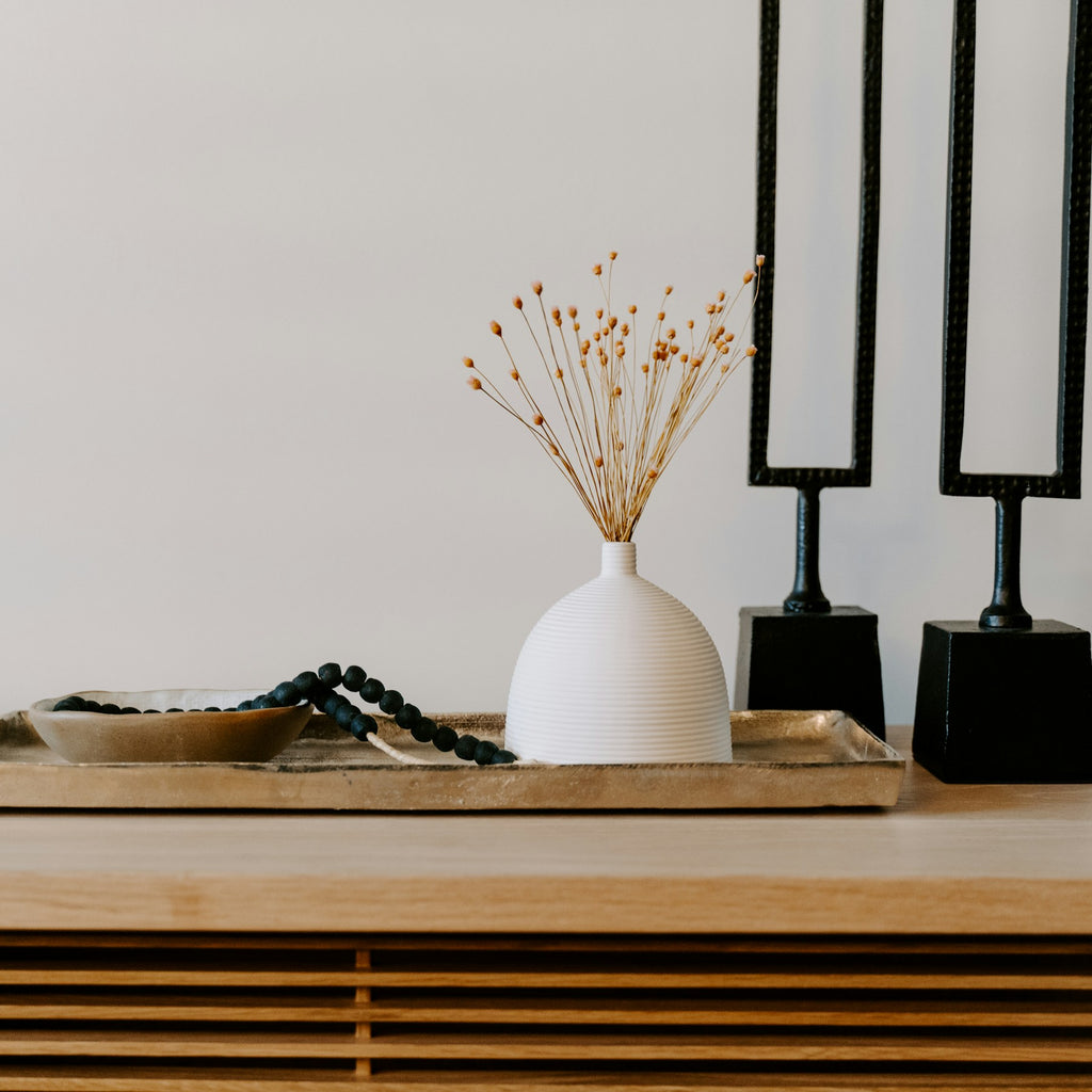 Lune tray styled with simple ceramic vessels