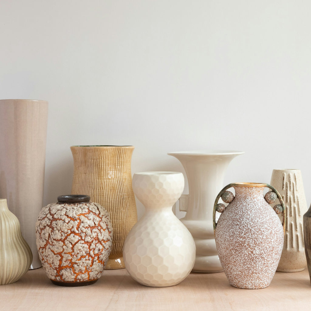 Assorted hand-finished ceramic vases in warm neutral tones