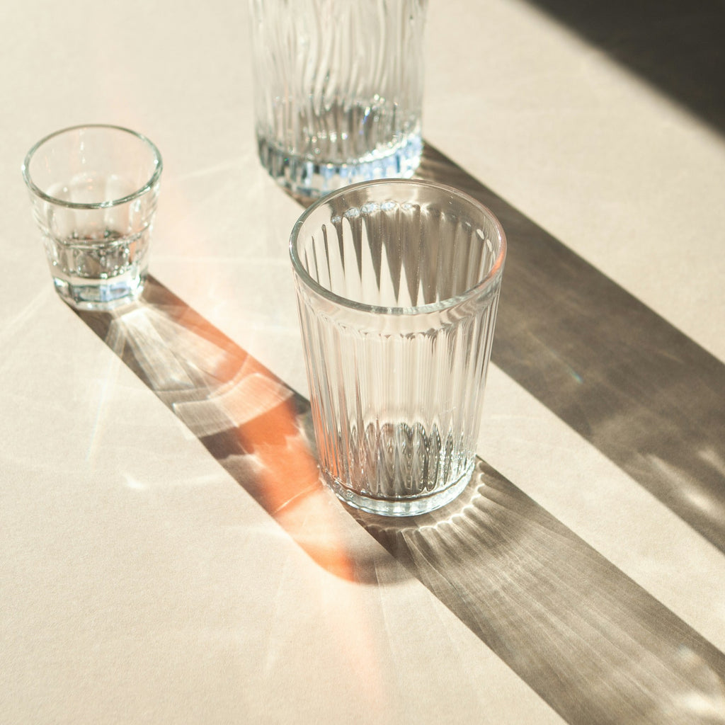 Clear Ripple ribbed glassware set on a sunlit table