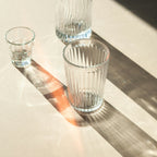 Clear Ripple ribbed glassware set on a sunlit table