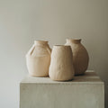 Neutral Sora ceramic vases displayed on a plinth