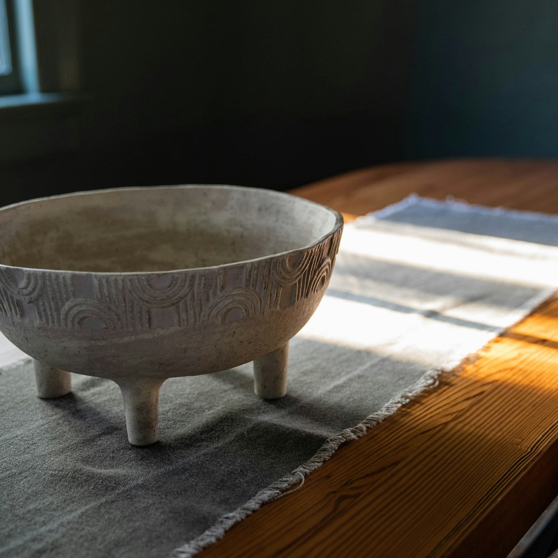 Smoked stoneware Arlo bowl on a sunlit table