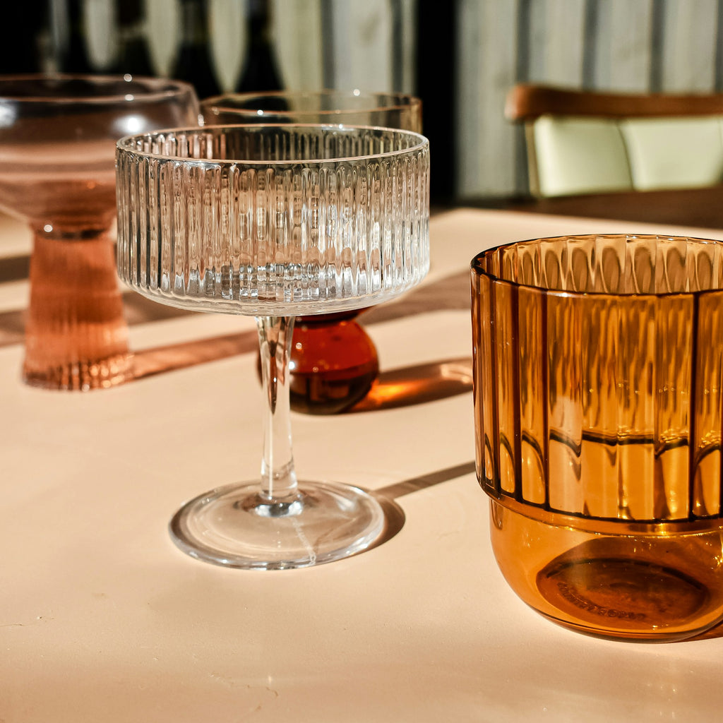 Amber and clear Ripple glasses styled together